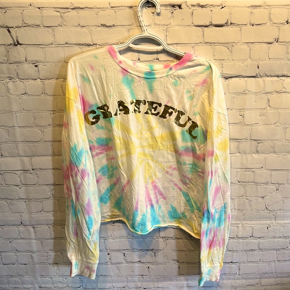 Tie dye white shirt with blue, pink and yellow. Gold grateful on front